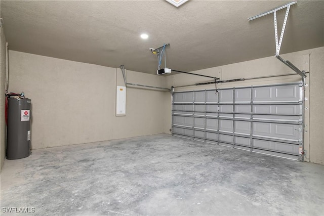 garage featuring electric water heater and a garage door opener