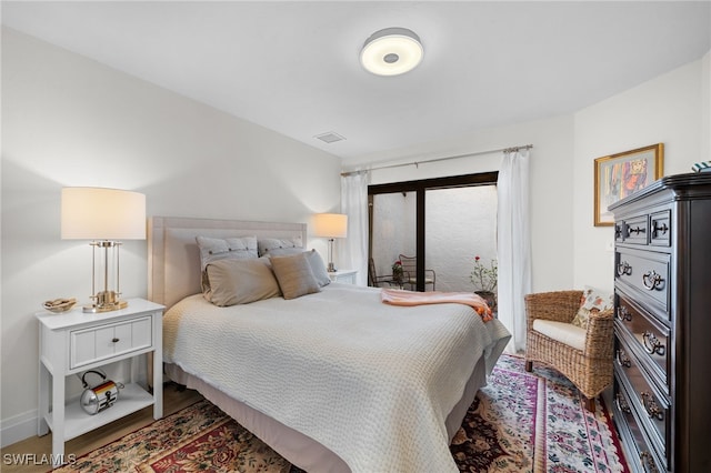 bedroom featuring hardwood / wood-style flooring