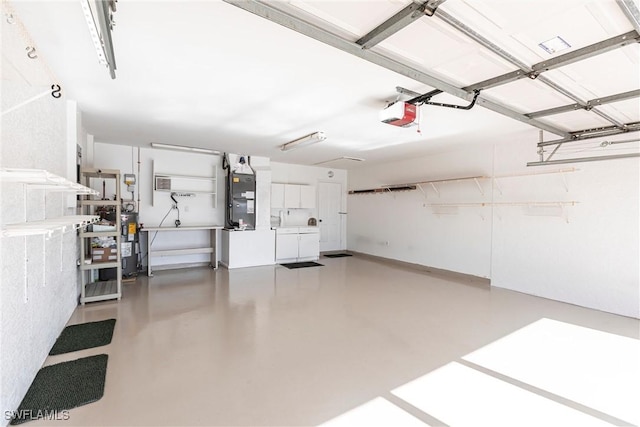 garage with a garage door opener, heating unit, and water heater