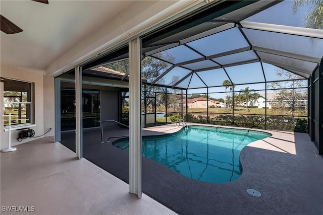 outdoor pool with a patio and a lanai