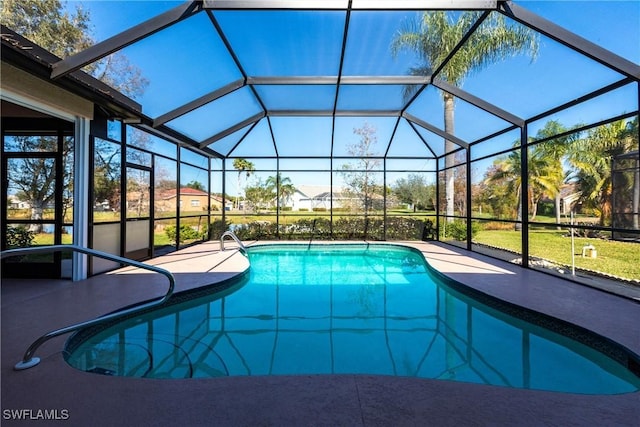 pool featuring a lanai and a patio area