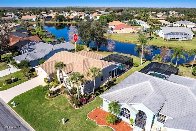 bird's eye view with a residential view and a water view