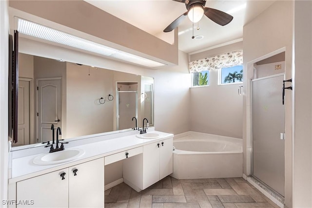 bathroom featuring vanity, independent shower and bath, and ceiling fan