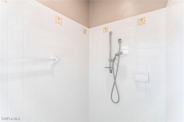 full bath featuring a tile shower