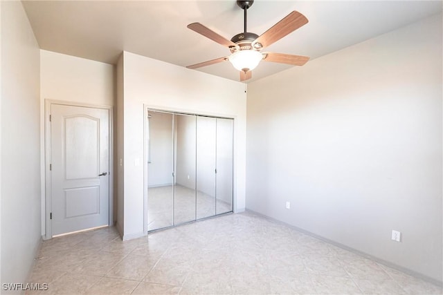 unfurnished bedroom with a closet and ceiling fan