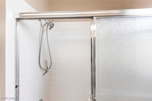 bathroom featuring an enclosed shower