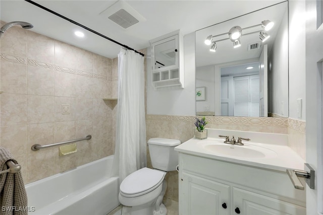 full bathroom with tile walls, vanity, toilet, and shower / bathtub combination with curtain