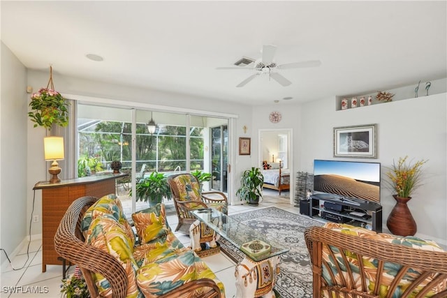 tiled living room with ceiling fan