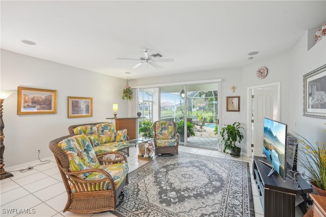 tiled living room featuring ceiling fan