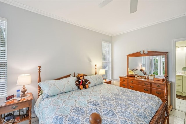 bedroom with light tile patterned floors, ornamental molding, ceiling fan, and ensuite bathroom