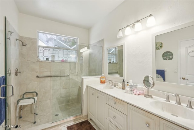 bathroom featuring vanity and walk in shower