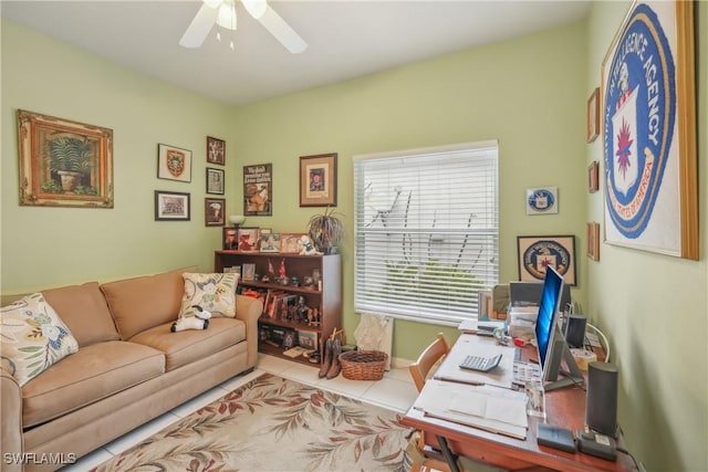 tiled office featuring ceiling fan