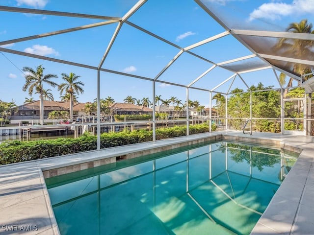 view of swimming pool with a lanai