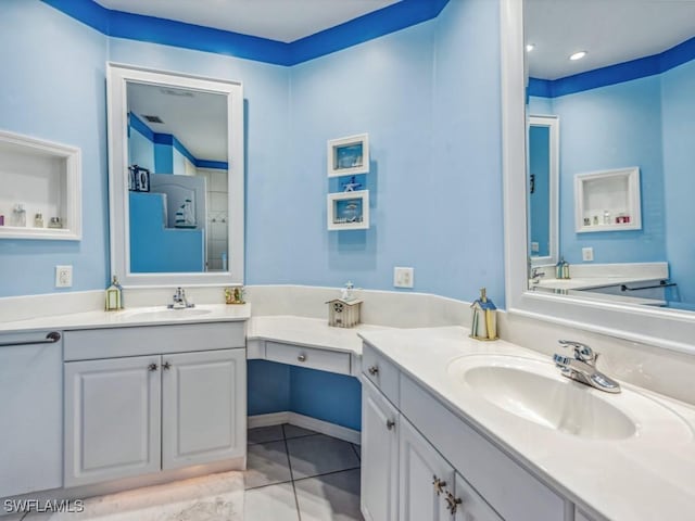 bathroom with tile patterned flooring and vanity