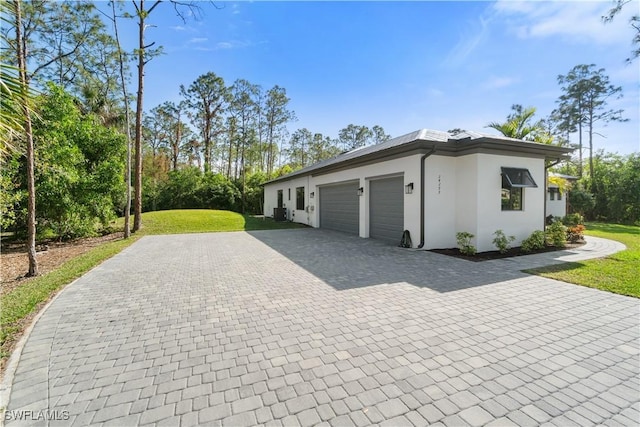 garage featuring a lawn