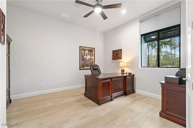 office space with light wood-type flooring and ceiling fan