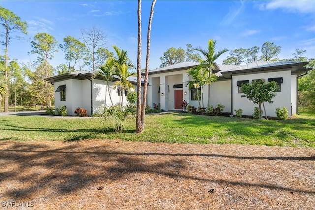 ranch-style house featuring a front yard