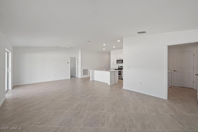 unfurnished living room with light tile patterned flooring