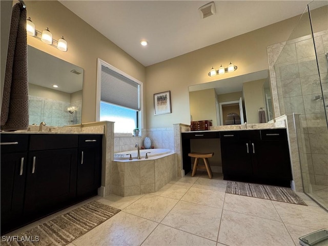 bathroom featuring tile patterned flooring, plus walk in shower, and vanity