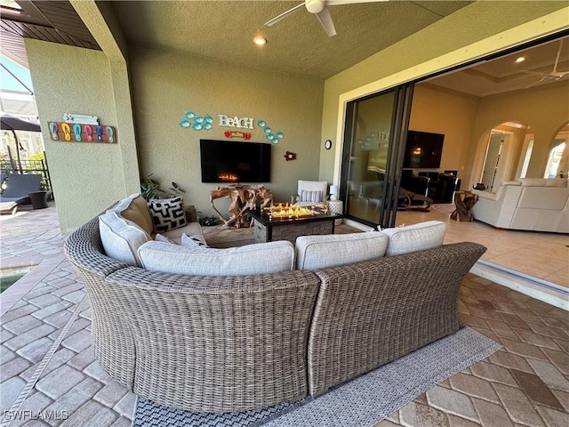 view of patio featuring ceiling fan and outdoor lounge area