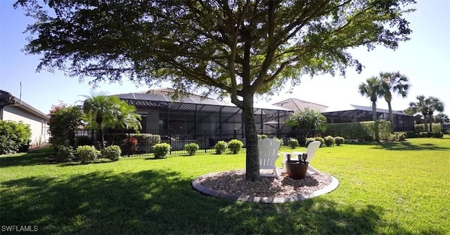 view of yard featuring glass enclosure