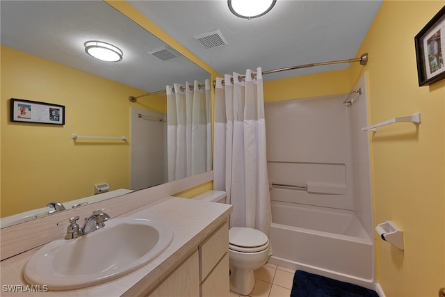 full bathroom featuring tile patterned flooring, vanity, shower / bath combo, and toilet