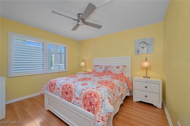 bedroom featuring ceiling fan and light hardwood / wood-style floors