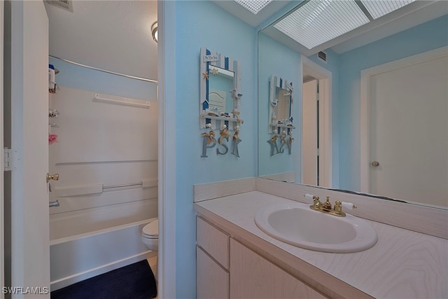 full bathroom with vanity, shower / washtub combination, and toilet