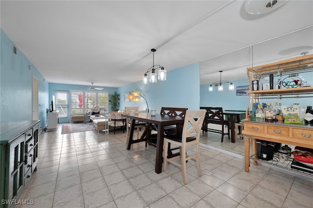 tiled dining area featuring ceiling fan