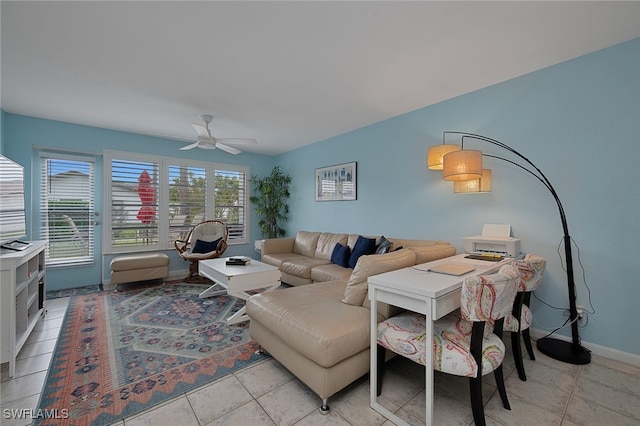 living room featuring ceiling fan and light tile patterned flooring