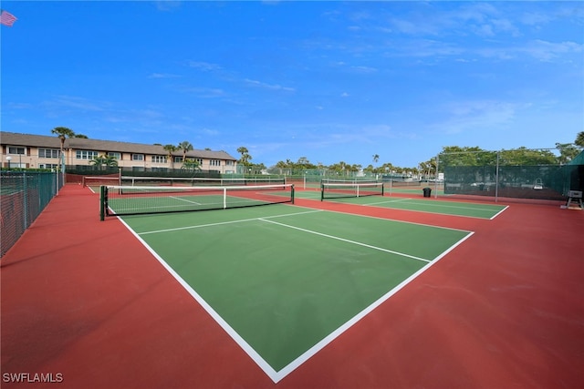 view of tennis court featuring basketball court