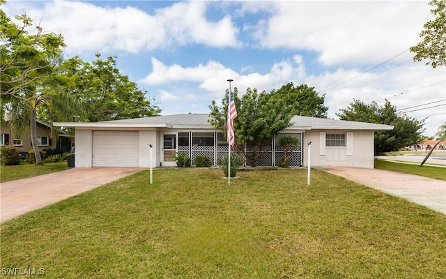 ranch-style home with a front yard and a garage