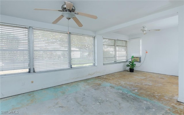 unfurnished sunroom featuring ceiling fan