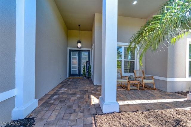 view of exterior entry featuring a porch