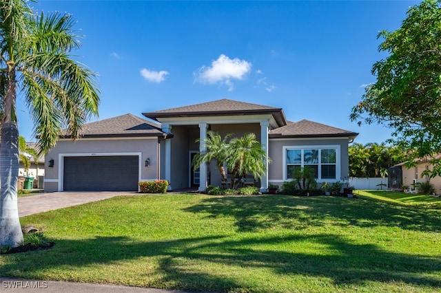 view of front facade featuring a garage and a front yard