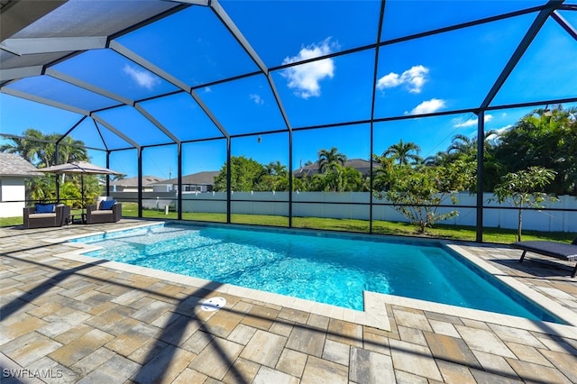 view of pool with a patio, a lanai, and an outdoor hangout area