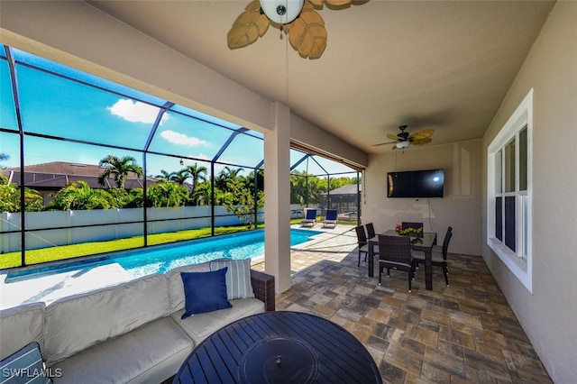 view of patio with an outdoor living space, a fenced in pool, ceiling fan, and glass enclosure