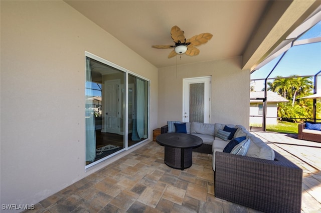 view of patio with outdoor lounge area, ceiling fan, and a lanai