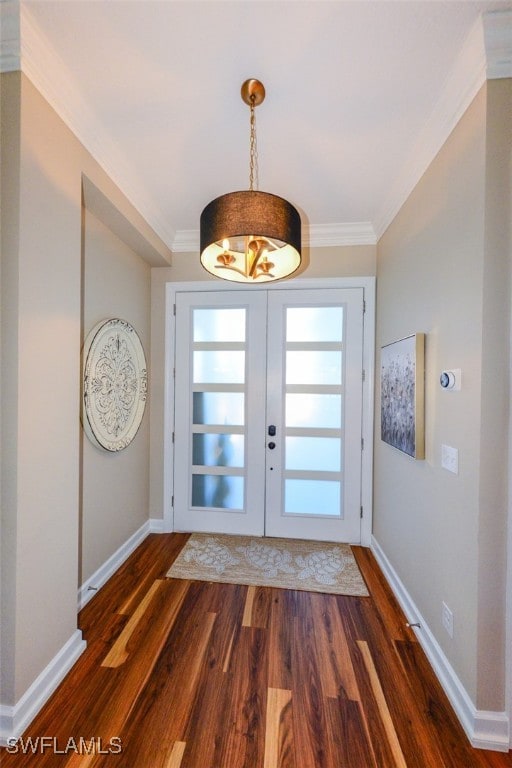 doorway featuring crown molding, dark hardwood / wood-style floors, and french doors