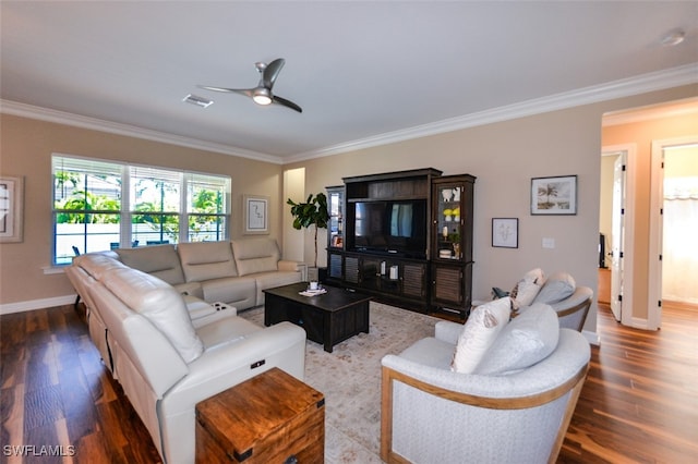 living room with dark hardwood / wood-style flooring, crown molding, and ceiling fan