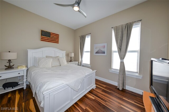 bedroom featuring dark hardwood / wood-style floors and ceiling fan