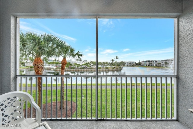 unfurnished sunroom with a water view