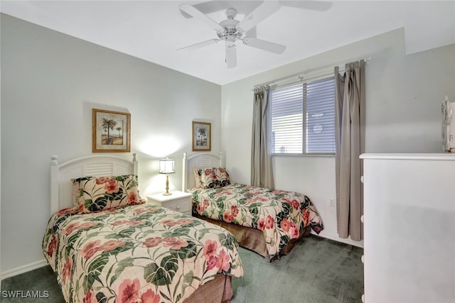 bedroom featuring dark carpet and ceiling fan