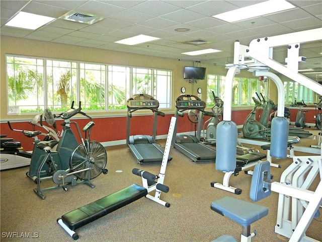 gym featuring a paneled ceiling