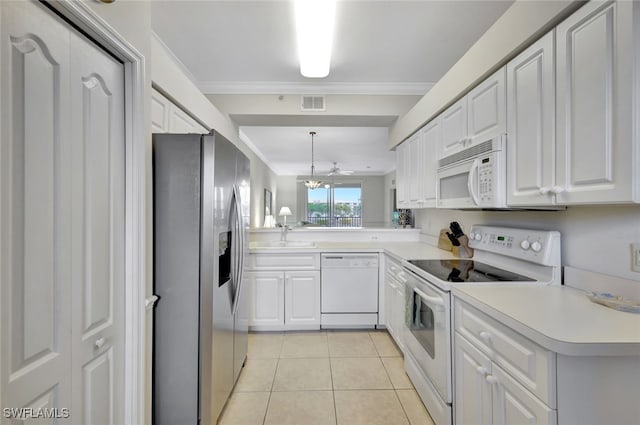 kitchen with white appliances, white cabinets, kitchen peninsula, and light tile patterned flooring