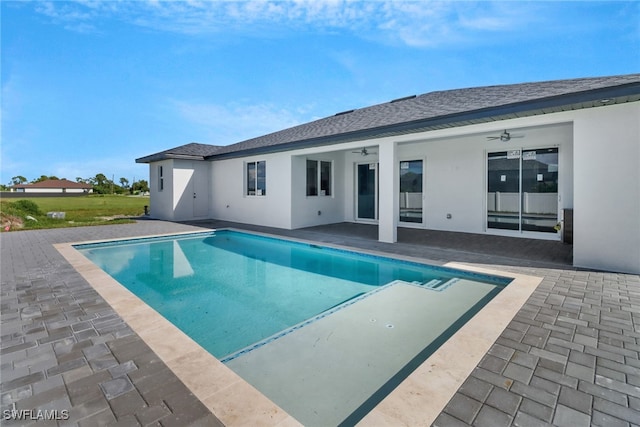 view of swimming pool with a patio area and ceiling fan