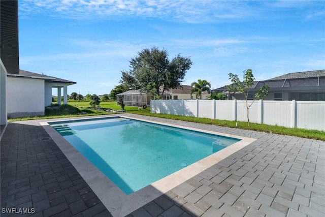 view of swimming pool with a patio