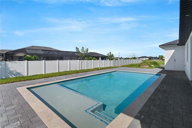 view of swimming pool with a patio