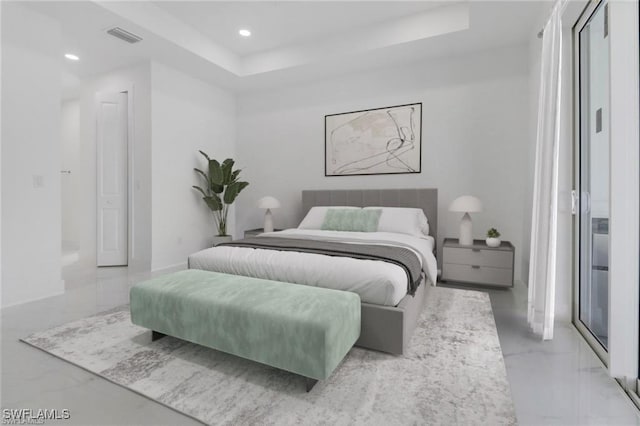 bedroom featuring a raised ceiling