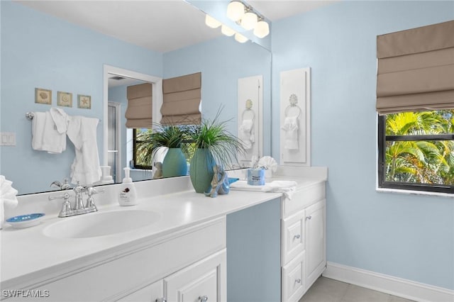 bathroom with tile patterned flooring and vanity